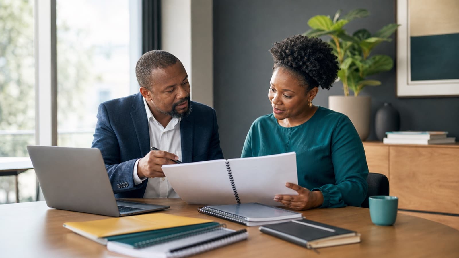 Accountant explaining annual financial statements to a South African business owner