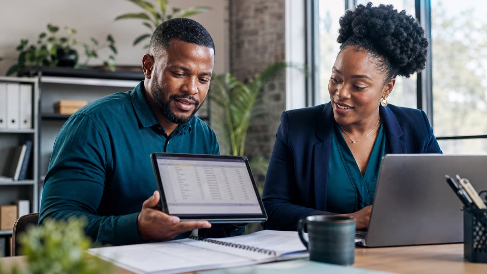 South African business owner and accountant reviewing a digital VAT workflow