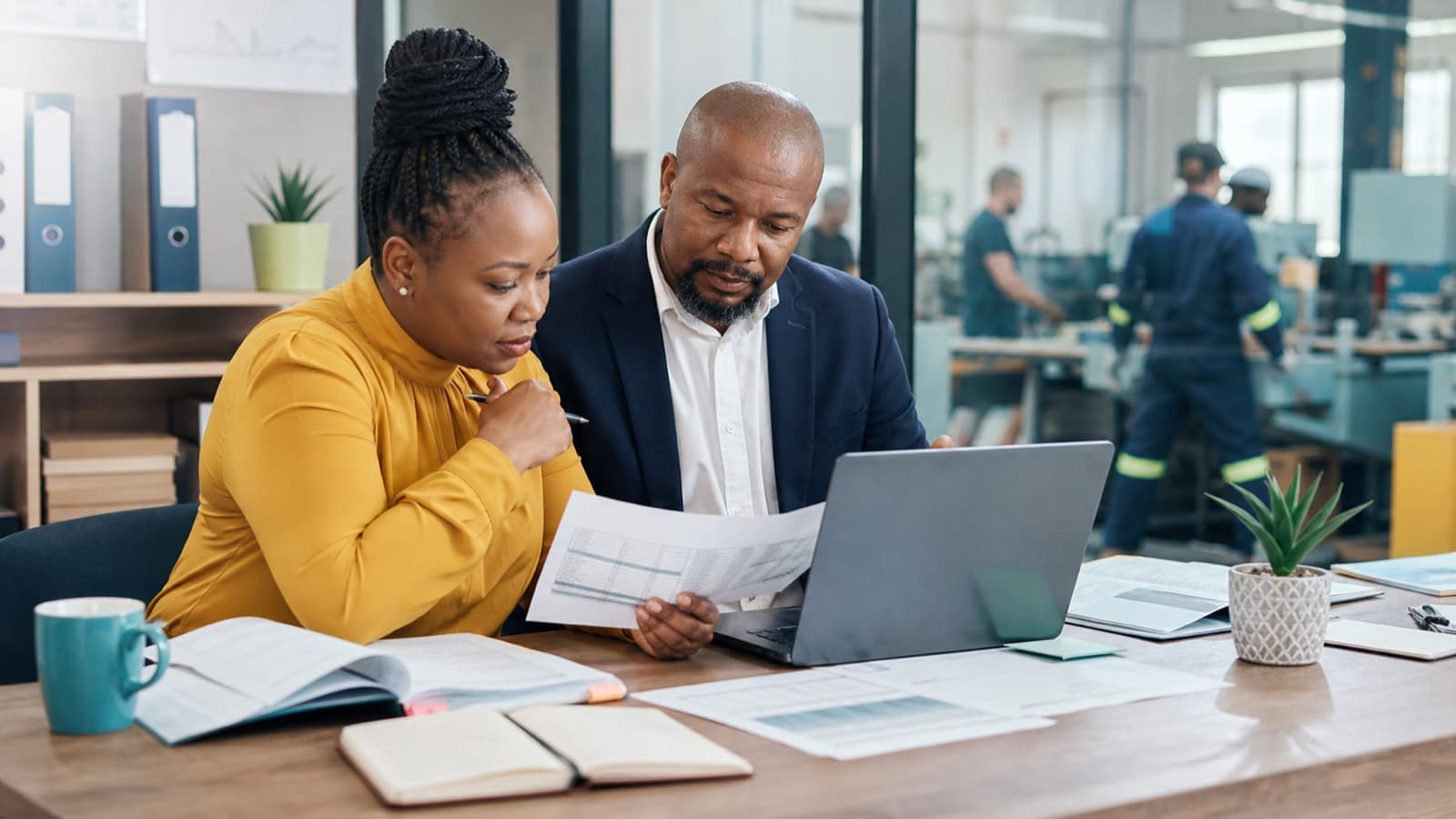 Employer and payroll administrator checking PAYE records before submission